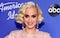 Katy Perry bares her baby bump in 'Daisies' music video